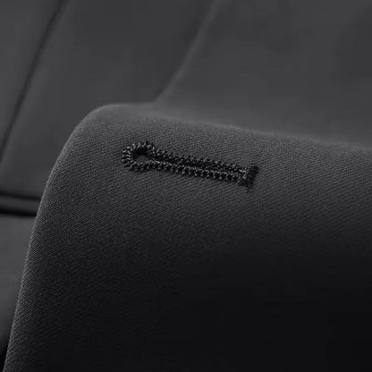 Close-up of the double-breasted jacket and waistcoat of a men's slim fit 3-piece suit.